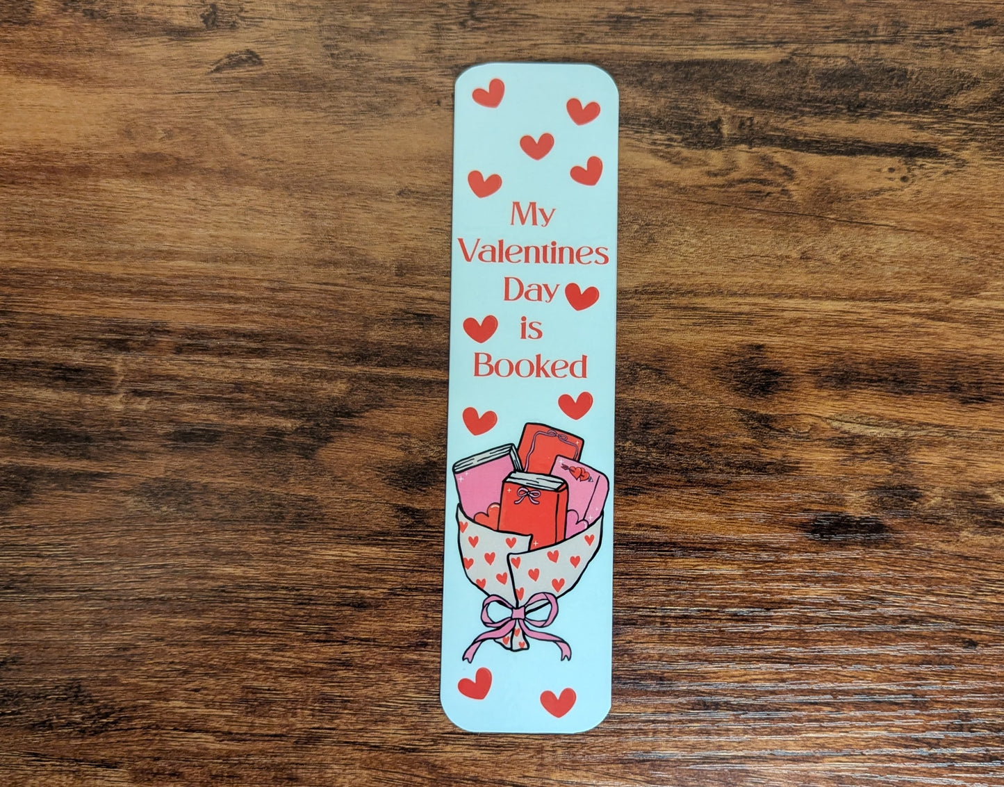 White bookmark with a book bouquet and read hearts